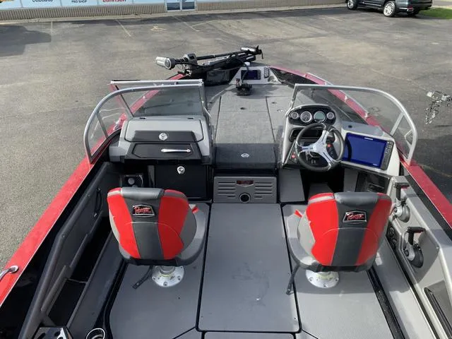 Slide: The Image of 2024 Ranger 621FS Cup boat interior with red seats and modern dashboard. - 4
