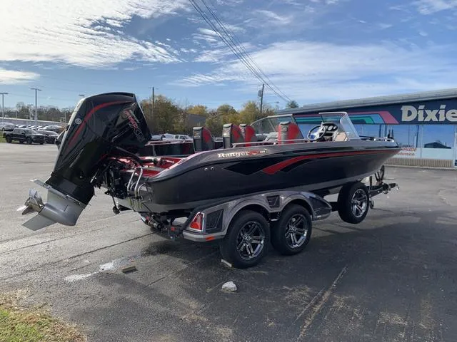 Slide: The Image of 2024 Ranger 621FS Cup boat on trailer, parked outdoors near dealership. - 7
