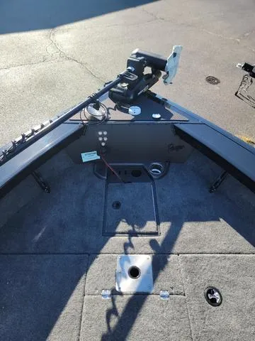 Slide: The Image of 2024 Ranger VX1888L boat deck with trolling motor and carpeted flooring. - 4