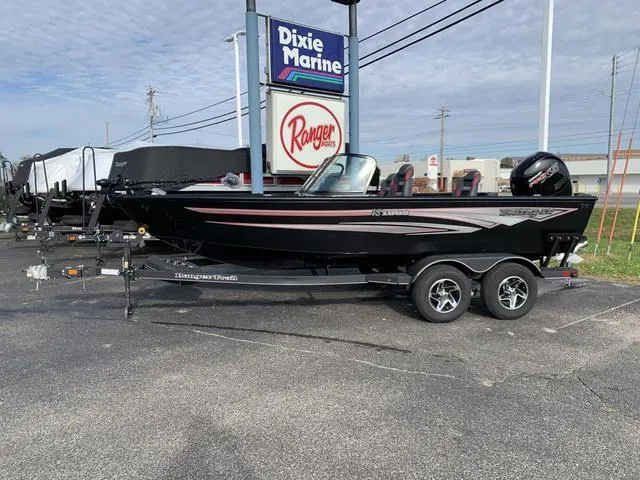 Slide: The Image of 2024 Ranger VS1882 boat at Dixie Marine dealership, black exterior, on a trailer. - 1