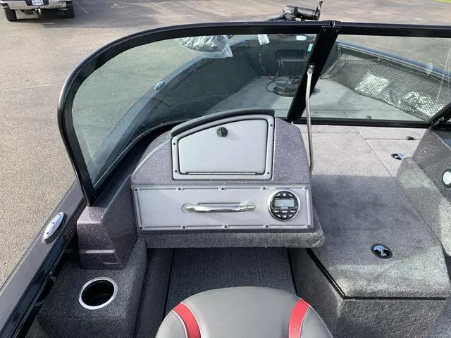 Slide: The Image of 2024 Ranger VS1882 boat interior with dashboard and seating. - 3