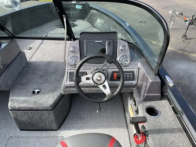 Slide: The Image of 2024 Ranger VS1882 boat cockpit with steering wheel and control panel. - 4