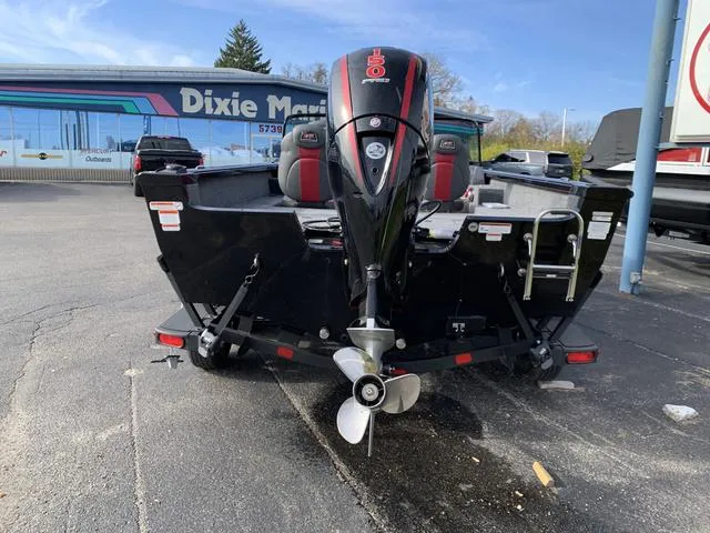 Slide: The Image of 2024 Ranger VS1882 boat with outboard motor, parked at Dixie Marine dealership. - 7