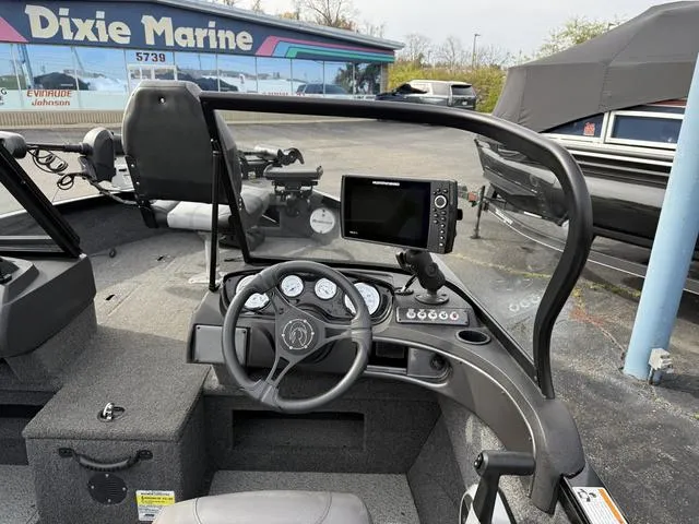 Slide: The Image of 2023 Crestliner 1750 FH boat dashboard with steering wheel and navigation system at Dixie Marine. - 5