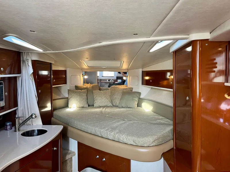 Slide: The Image of Luxurious interior of 2009 Sea Ray 310 Sundancer yacht with cozy bed and kitchenette. - 16