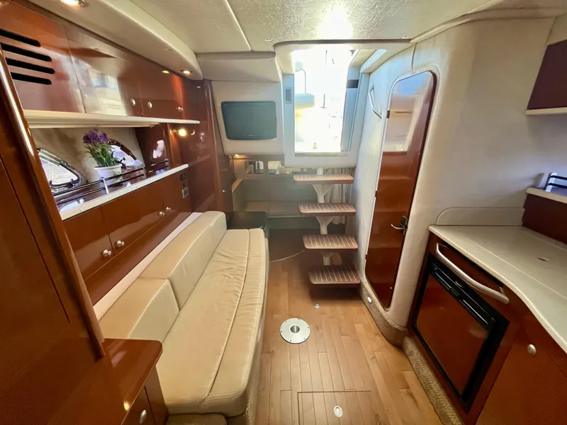 Slide: The Image of Luxurious interior of 2009 Sea Ray 310 Sundancer yacht with wood finishes and modern amenities. - 20