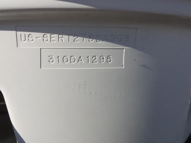 Slide: The Image of 2009 Sea Ray 310 Sundancer hull identification number on boat exterior. - 23