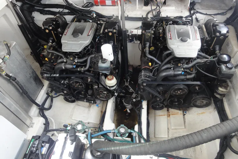 Slide: The Image of Engine compartment of a 2009 Sea Ray 310 Sundancer boat, featuring dual inboard motors. - 28