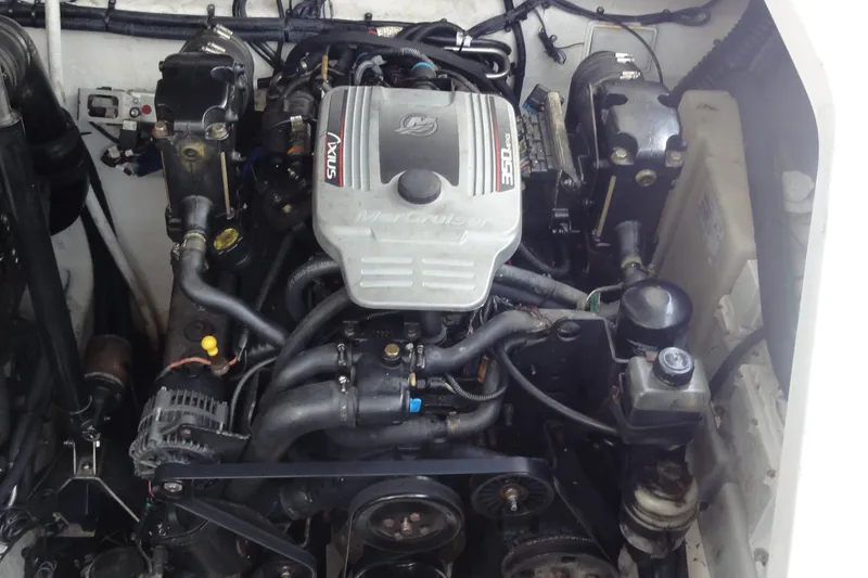Slide: The Image of Engine compartment of a 2009 Sea Ray 310 Sundancer boat, showcasing detailed components. - 30
