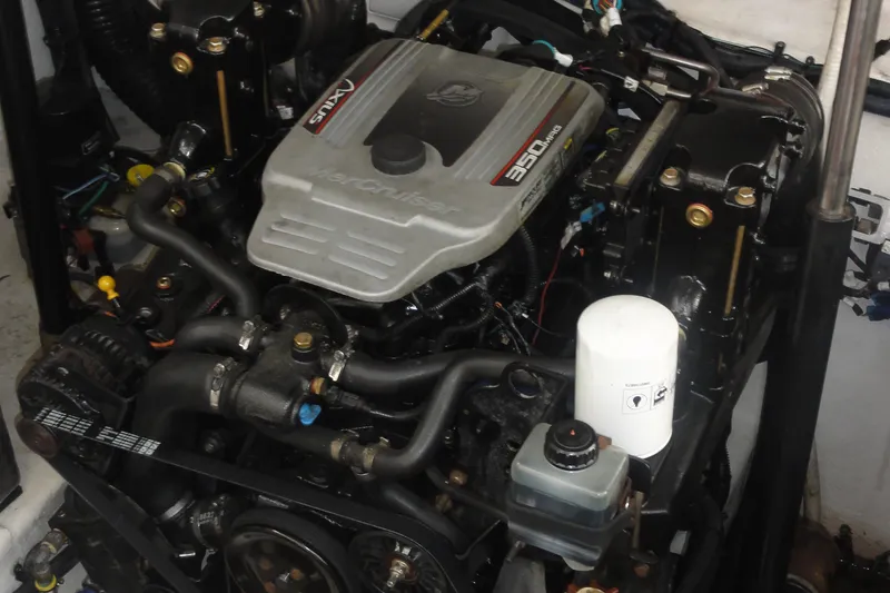 Slide: The Image of Engine of a 2009 Sea Ray 310 Sundancer boat, featuring a MerCruiser 350 MAG. - 31