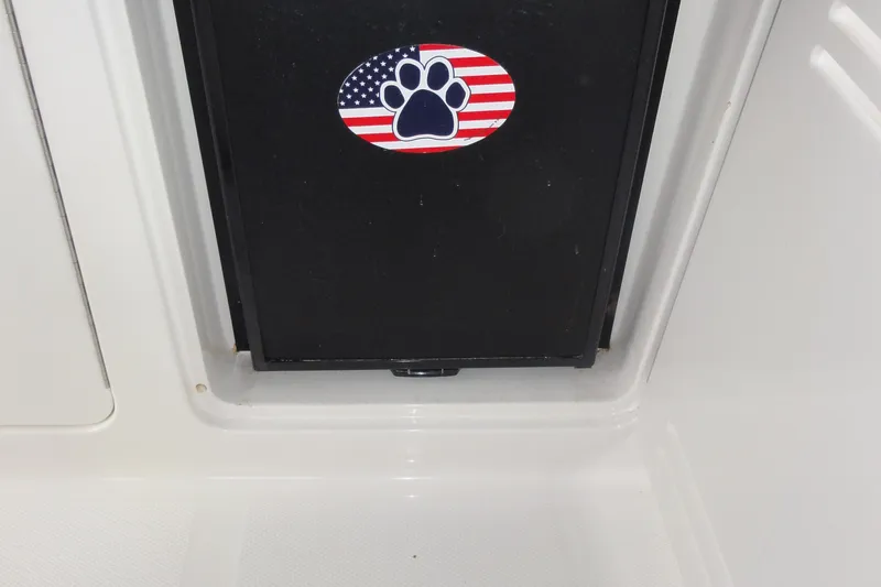 Slide: The Image of 2009 Sea Ray 310 Sundancer boat detail with American flag paw print sticker. - 43