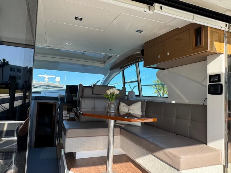 Slide: The Image of Luxurious interior of 2019 Cruisers Yachts 42 Cantius with modern seating and table. - 11
