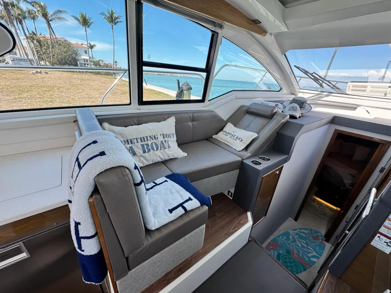 Slide: The Image of Interior of 2019 Cruisers Yachts 42 Cantius with cozy seating and nautical decor. - 15