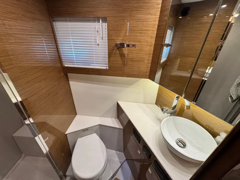 Slide: The Image of Luxurious bathroom in 2019 Cruisers Yachts 42 Cantius with modern fixtures and wood accents. - 26