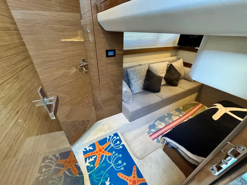 Slide: The Image of 2019 Cruisers Yachts 42 Cantius interior with cozy seating and nautical-themed decor. - 28