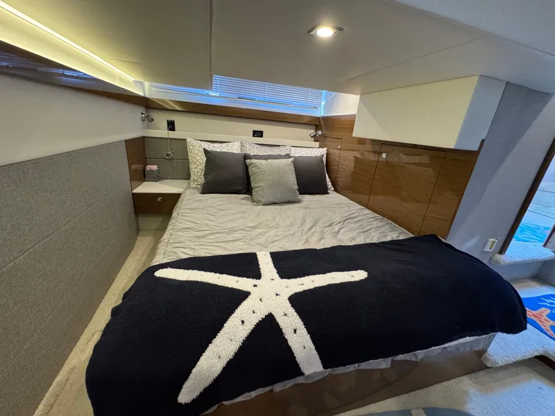 Slide: The Image of Luxurious bedroom in 2019 Cruisers Yachts 42 Cantius with starfish blanket. - 31