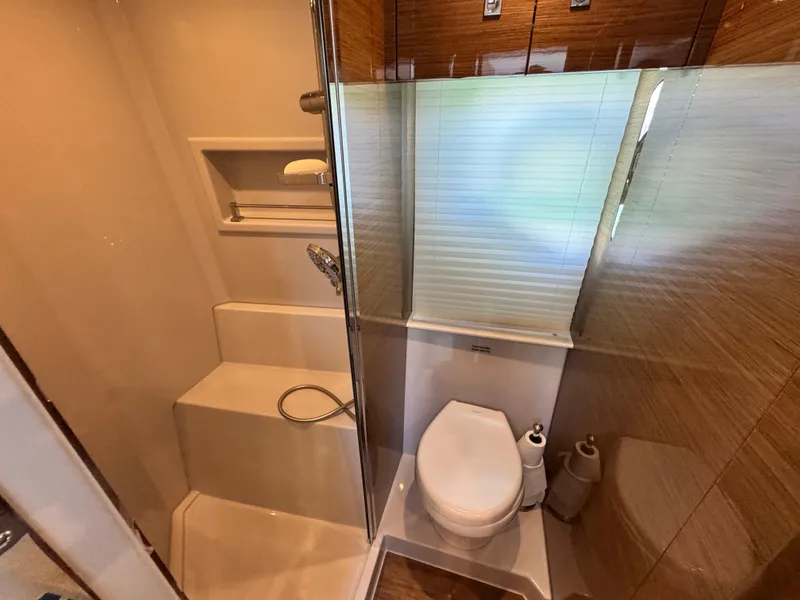 Slide: The Image of Luxurious bathroom in 2019 Cruisers Yachts 42 Cantius with modern shower and toilet. - 34