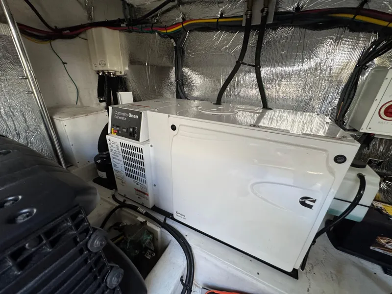 Slide: The Image of Engine room of 2019 Cruisers Yachts 42 Cantius with Cummins Onan generator. - 38