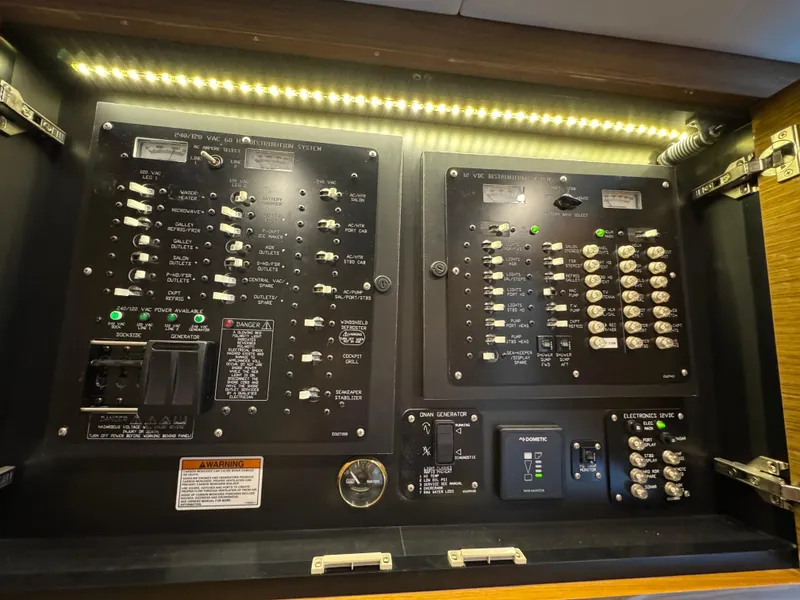 Slide: The Image of Electrical control panel of 2019 Cruisers Yachts 42 Cantius, illuminated with LED lighting. - 40