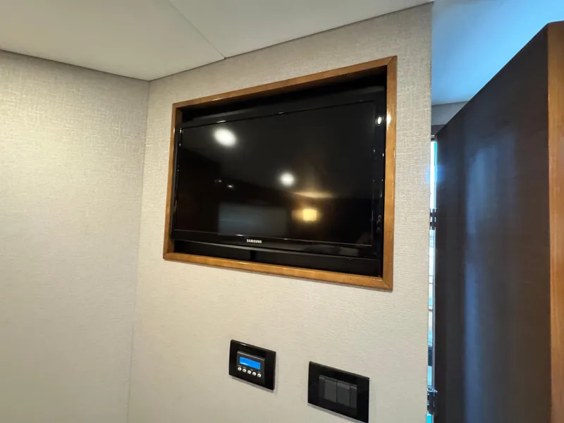 Slide: The Image of Samsung TV in 2019 Cruisers Yachts 42 Cantius interior, wall-mounted with control panel. - 25