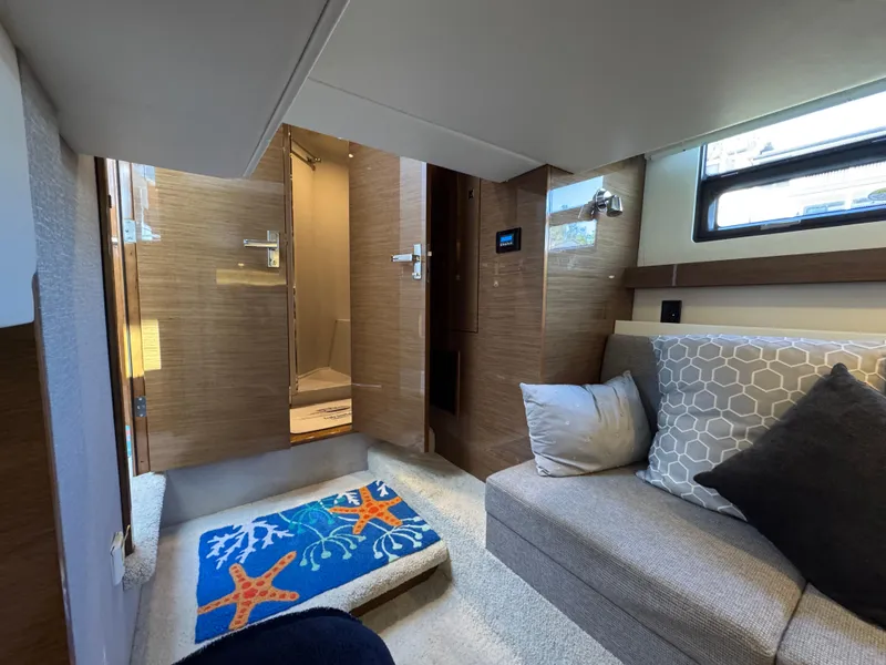 Slide: The Image of Interior of 2019 Cruisers Yachts 42 Cantius with cozy seating and nautical decor. - 32