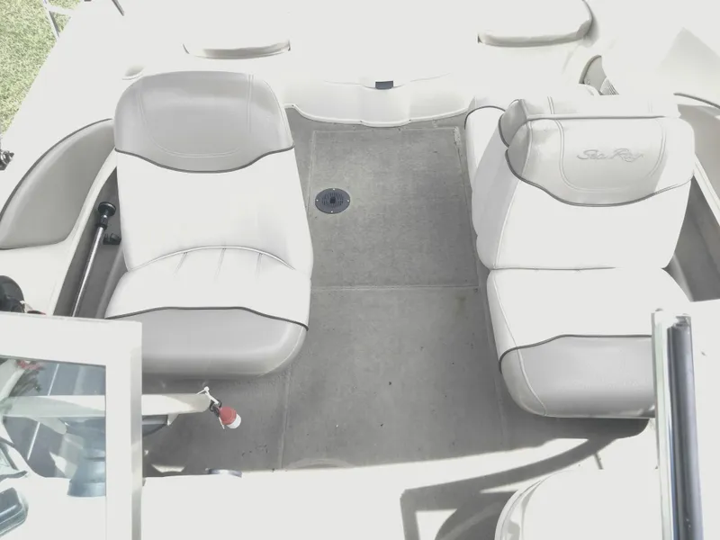 Slide: The Image of Interior of 2002 Sea Ray 176 Bow Rider with gray seating and carpet. - 12