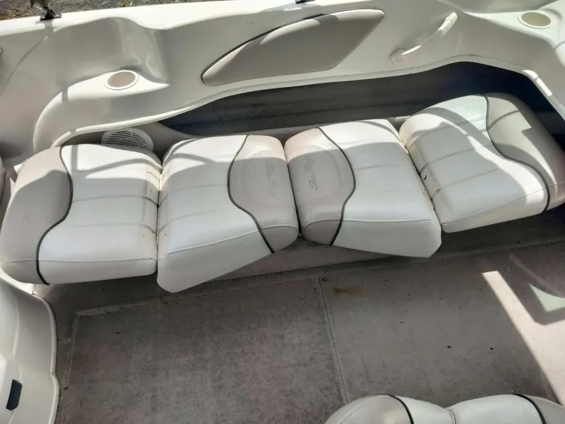 Slide: The Image of 2002 Sea Ray 176 Bow Rider interior with white cushioned seating. - 14