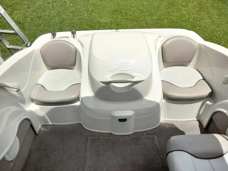 Slide: The Image of 2002 Sea Ray 176 Bow Rider interior with seating and storage. - 15