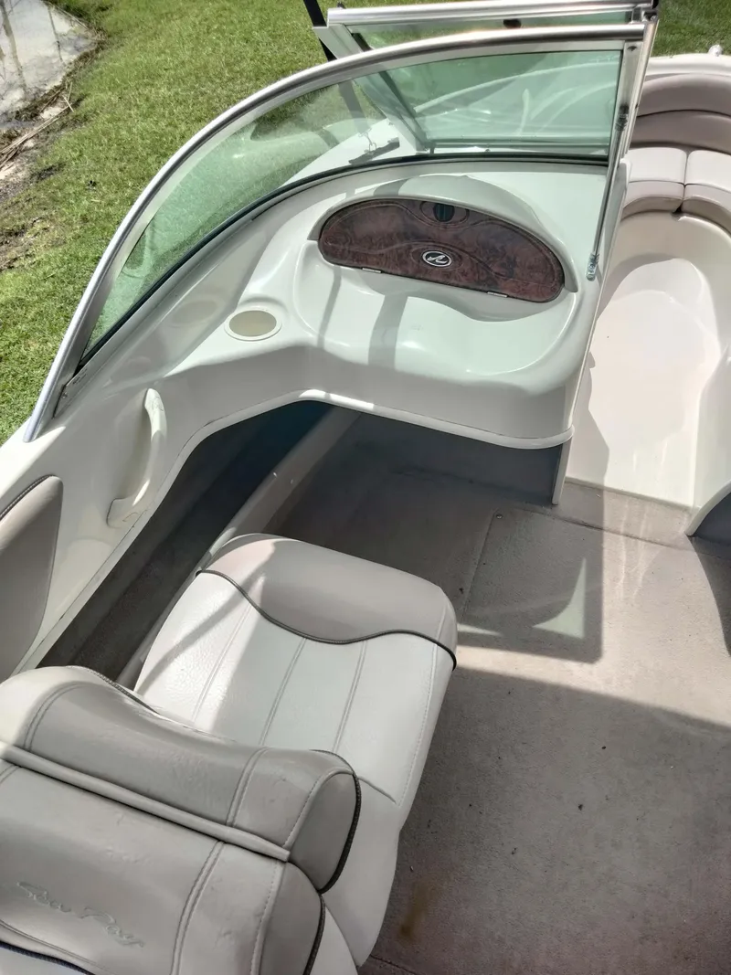 Slide: The Image of Interior of 2002 Sea Ray 176 Bow Rider boat with seating and dashboard. - 9