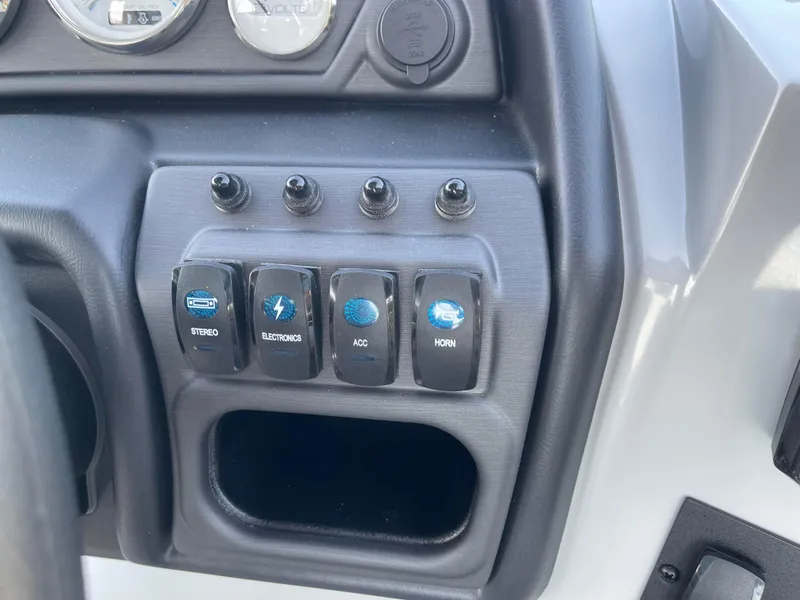 Slide: The Image of Control panel of 2025 Bentley Pontoons Legacy 203 Navigator with labeled switches. - 14
