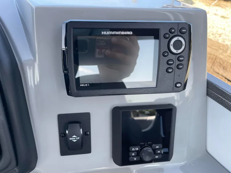 Slide: The Image of 2025 Bentley Pontoons Legacy 203 Navigator dashboard with Humminbird Helix 5 and JBL controls. - 15