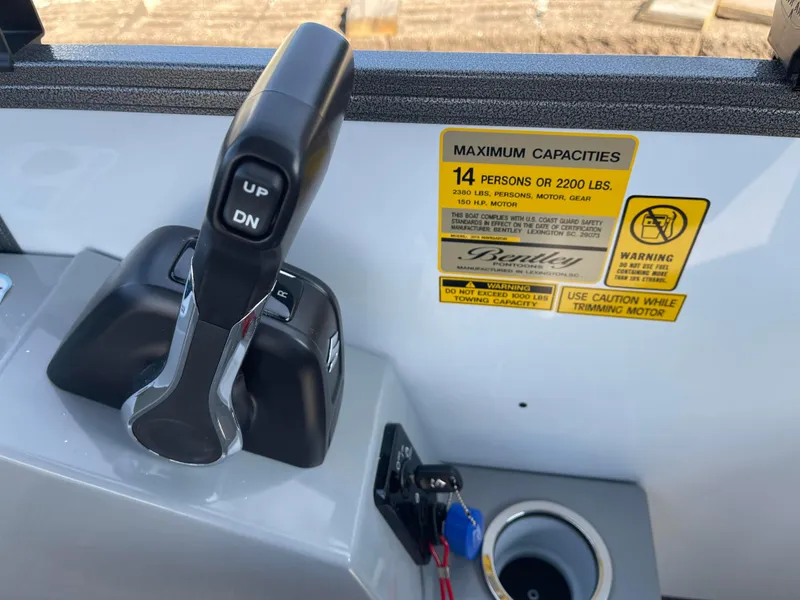 Slide: The Image of Bentley Pontoons Legacy 203 Navigator 2025 control panel with capacity warning label. - 16