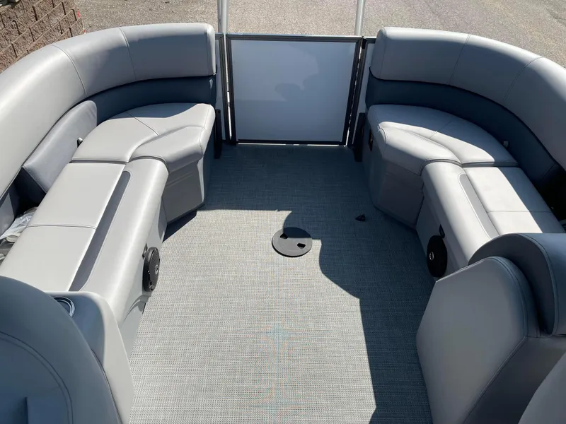 Slide: The Image of 2025 Bentley Pontoons Legacy 203 Navigator interior with gray seating and carpeted floor. - 18