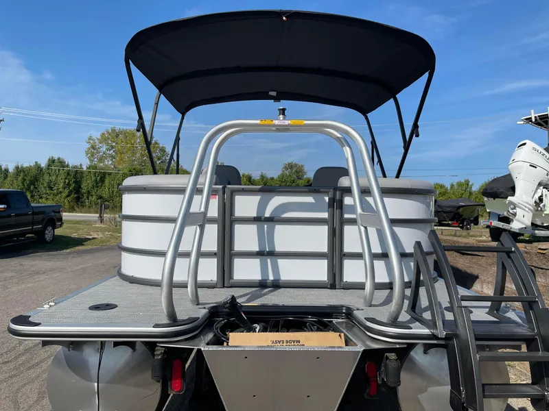 Slide: The Image of 2025 Bentley Pontoons Legacy 203 Navigator, rear view with canopy and ladder. - 3