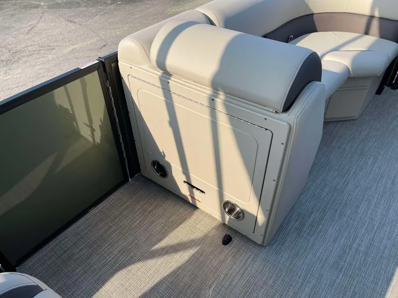 Slide: The Image of 2025 Bentley Pontoons Legacy 203 Swingback interior seating with beige upholstery. - 11