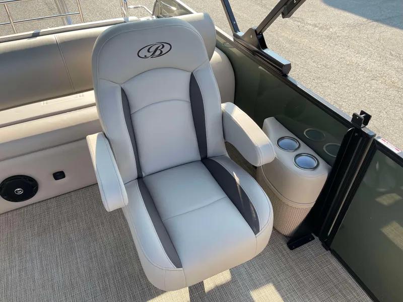Slide: The Image of 2025 Bentley Pontoons Legacy 203 Swingback interior with luxurious seating and cup holders. - 13