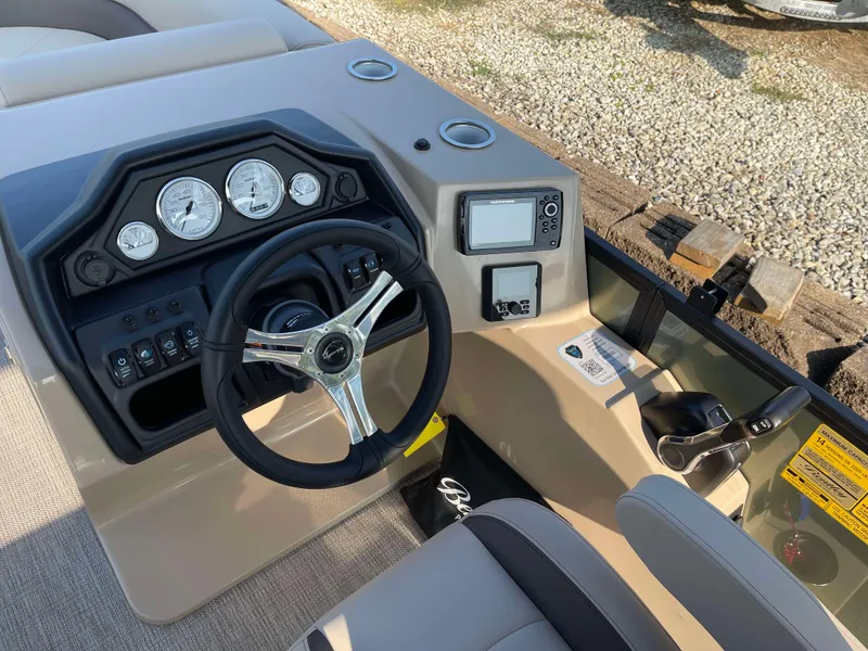 Slide: The Image of 2025 Bentley Pontoons Legacy 203 Swingback dashboard with steering wheel and gauges. - 15