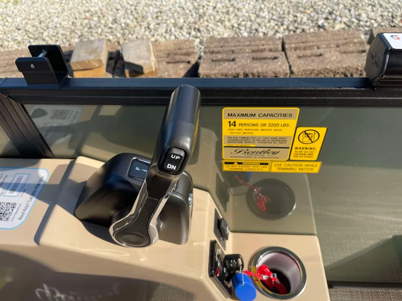 Slide: The Image of Control panel of 2025 Bentley Pontoons Legacy 203 Swingback with capacity label. - 20