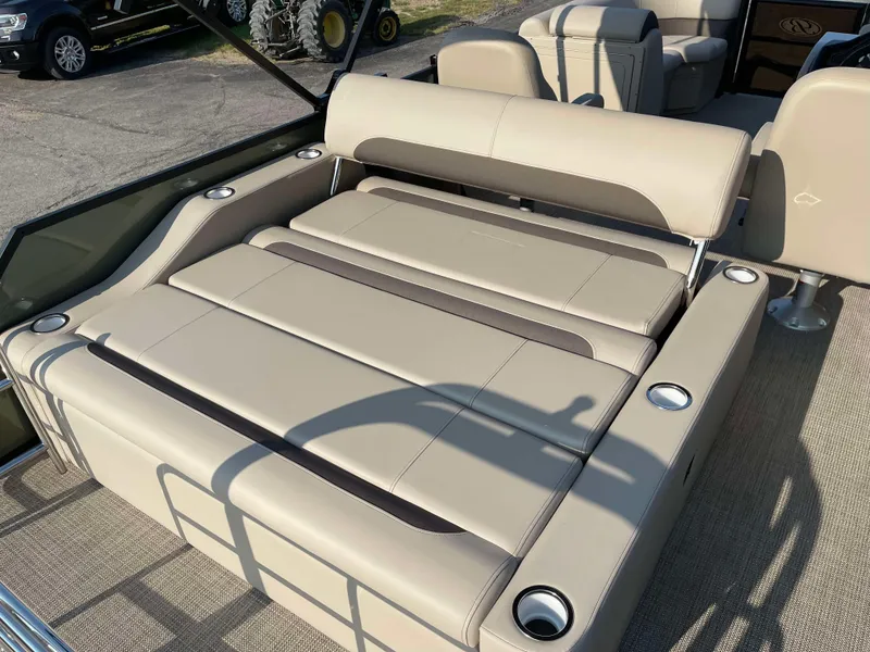 Slide: The Image of 2025 Bentley Pontoons Legacy 203 Swingback with luxurious seating and cup holders. - 22