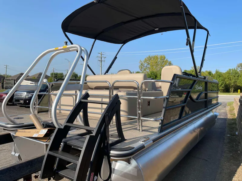 Slide: The Image of 2025 Bentley Pontoons Legacy 203 Swingback with canopy, parked outdoors. - 5