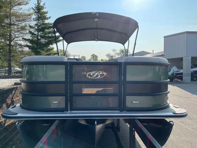 Slide: The Image of 2025 Bentley Pontoons Legacy 203 Swingback pontoon boat with canopy in a sunny outdoor setting. - 6