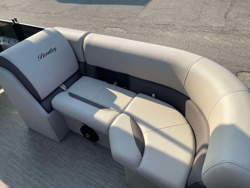 Slide: The Image of 2025 Bentley Pontoons Legacy 203 Swingback seating, featuring luxurious beige upholstery. - 9