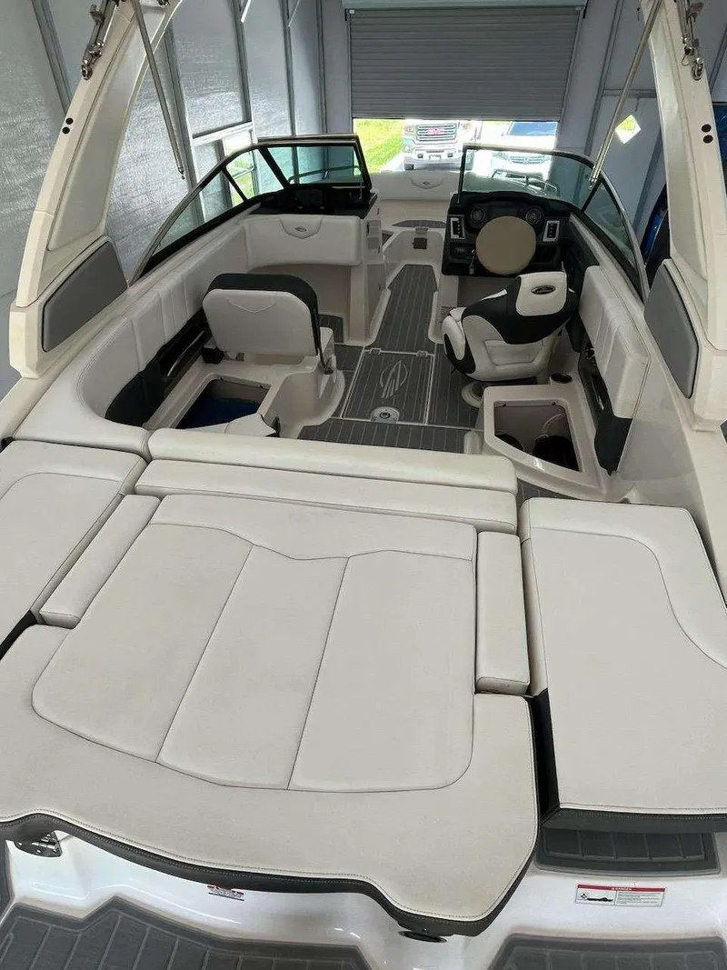 Slide: The Image of 2019 Chaparral 237 SSX boat interior with spacious seating and modern design. - 12