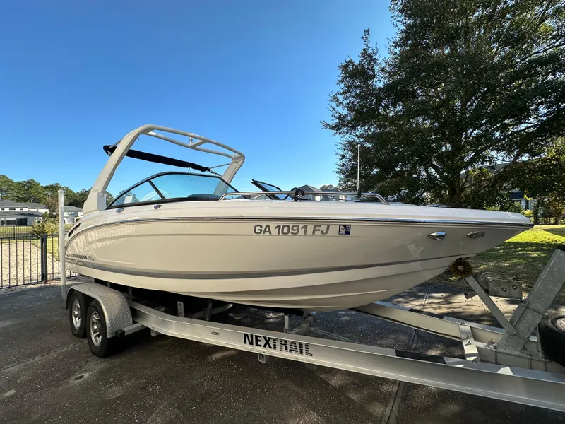 Slide: The Image of 2019 Chaparral 237 SSX boat on trailer, parked outdoors. - 19