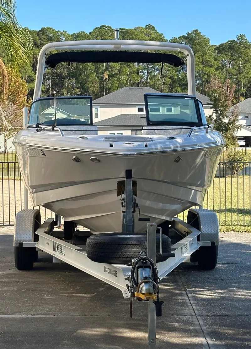 Slide: The Image of 2019 Chaparral 237 SSX boat on trailer, parked outdoors. - 20