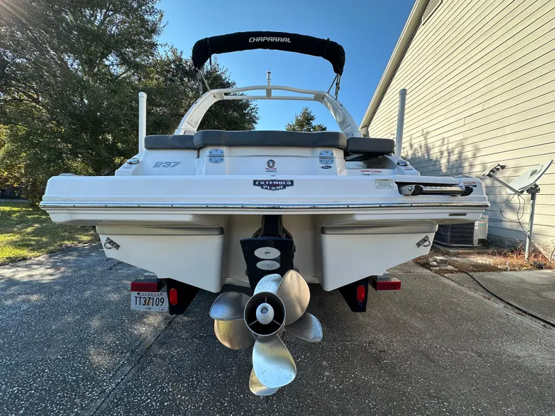 Slide: The Image of 2019 Chaparral 237 SSX boat, rear view, parked on driveway. - 3