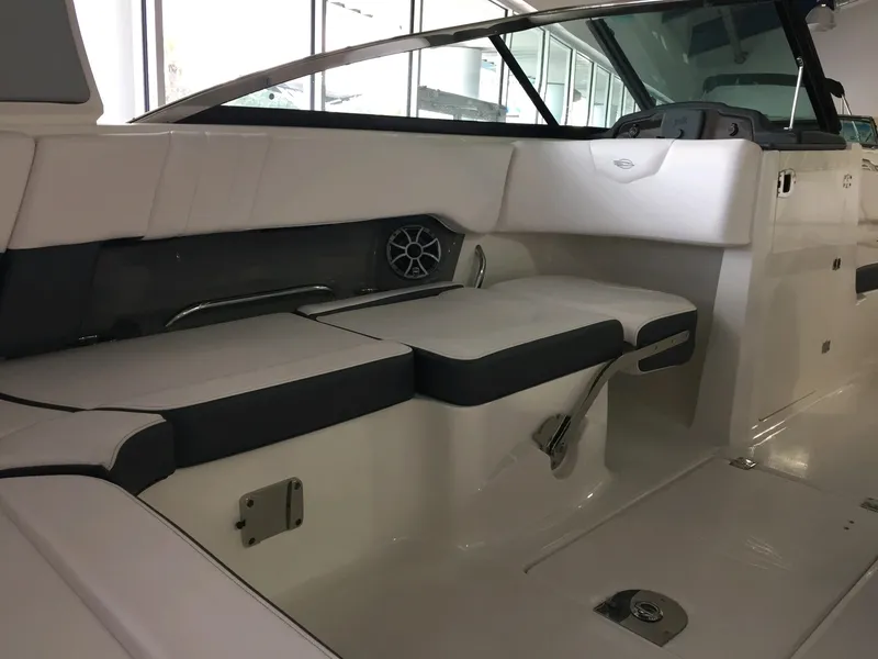 Slide: The Image of Interior of 2019 Chaparral 237 SSX boat with white seating and modern design. - 9