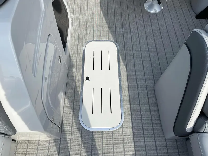 Slide: The Image of 2025 Bentley Pontoons Elite 223 Swingback deck with storage compartment. - 10