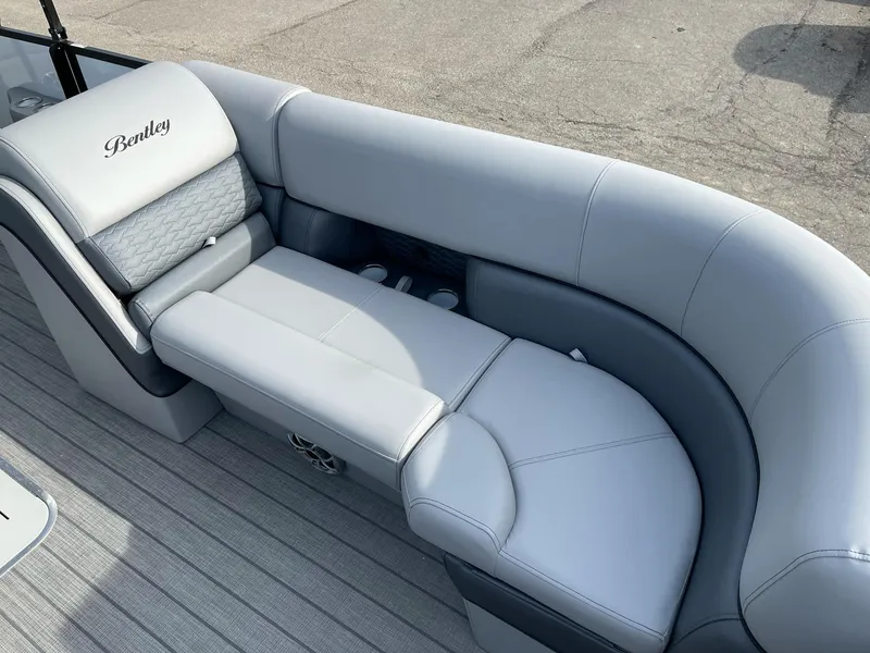 Slide: The Image of 2025 Bentley Pontoons Elite 223 Swingback with luxurious gray seating and sleek design. - 11