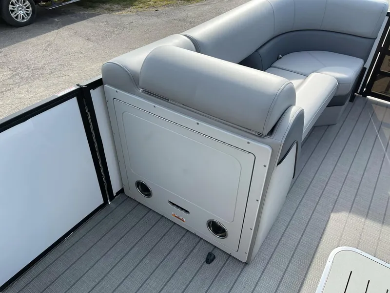 Slide: The Image of 2025 Bentley Pontoons Elite 223 Swingback interior with gray seating and flooring. - 12